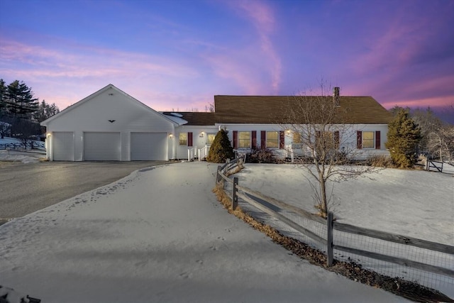 ranch-style home featuring a garage