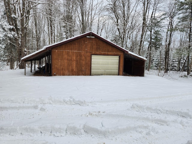 view of snow covered garage