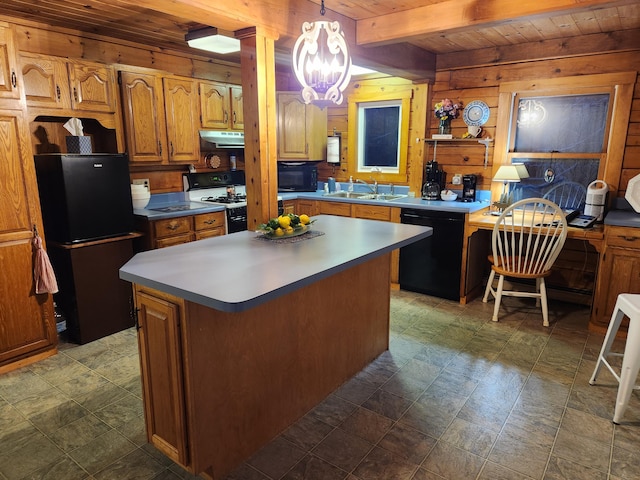 kitchen with sink, wooden ceiling, decorative light fixtures, a kitchen island, and black appliances