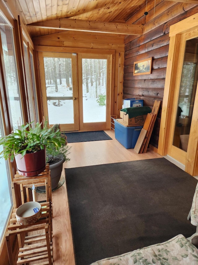 entryway featuring lofted ceiling, french doors, light wood-type flooring, rustic walls, and wood ceiling