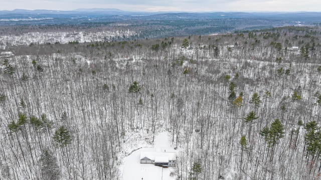 snowy aerial view with a mountain view