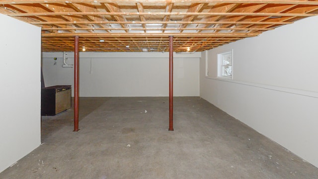 basement featuring stainless steel fridge