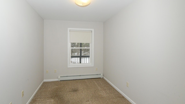 carpeted empty room featuring a baseboard radiator