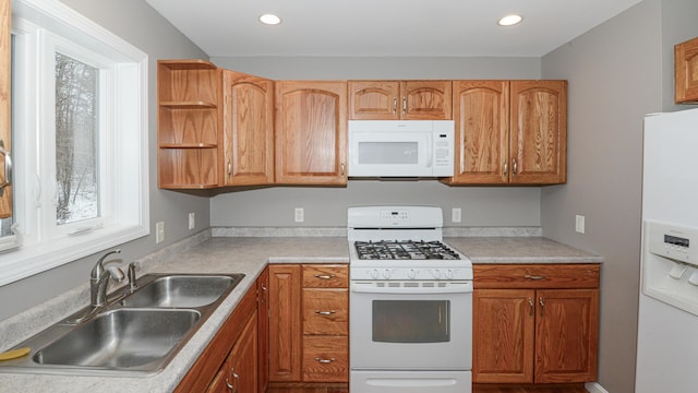 kitchen with white appliances and sink