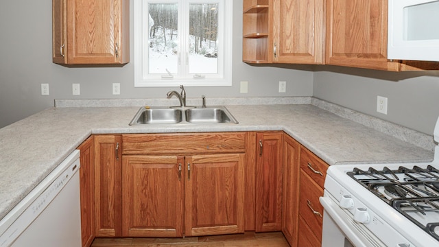 kitchen with white appliances and sink