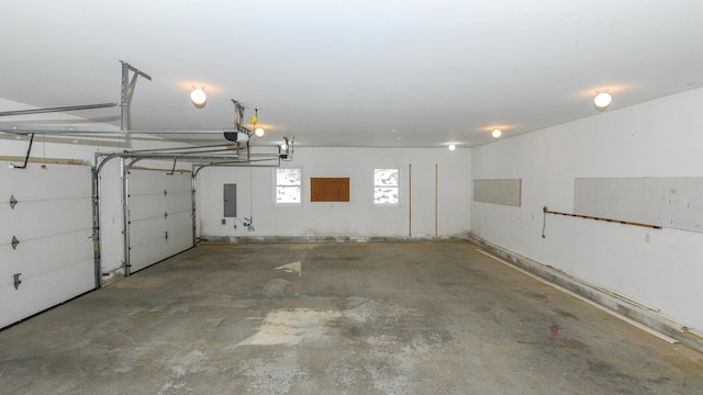 garage featuring a garage door opener and electric panel