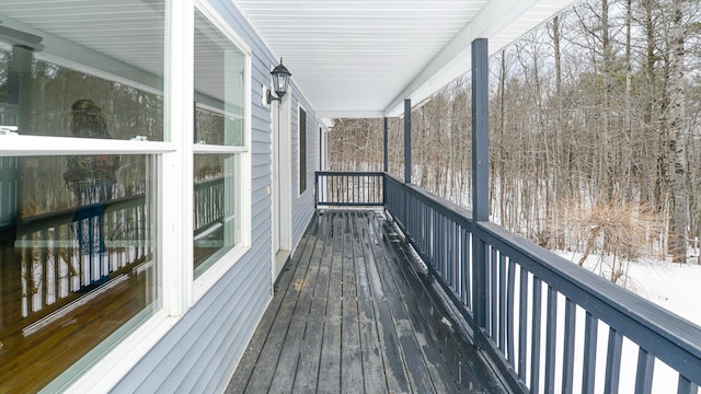 view of snow covered deck