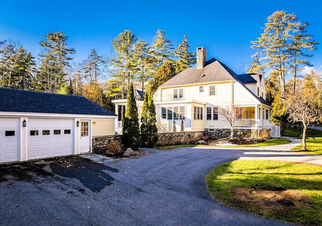 view of side of home with a porch