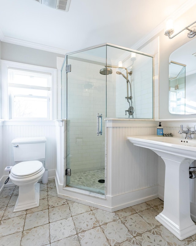 bathroom featuring an enclosed shower, ornamental molding, wooden walls, tile patterned flooring, and toilet