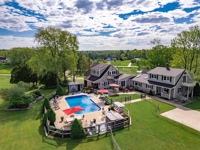 view of pool featuring a yard