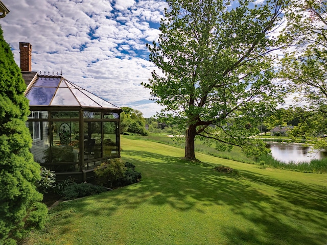 view of yard featuring a gazebo and a water view