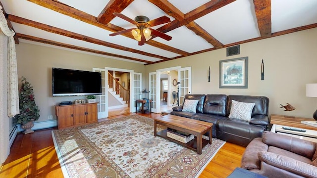 living room featuring beamed ceiling, french doors, hardwood / wood-style flooring, and ceiling fan