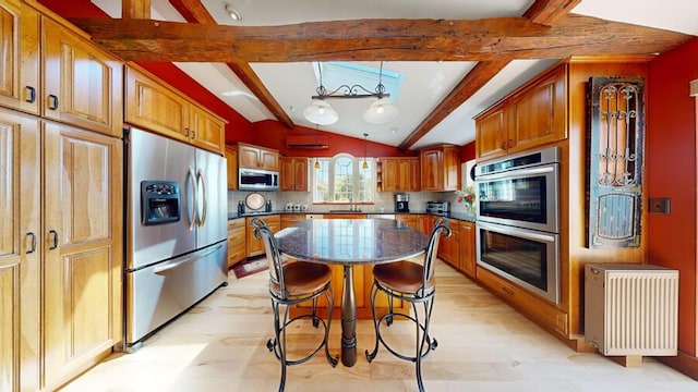 kitchen featuring radiator, a center island, decorative light fixtures, decorative backsplash, and appliances with stainless steel finishes