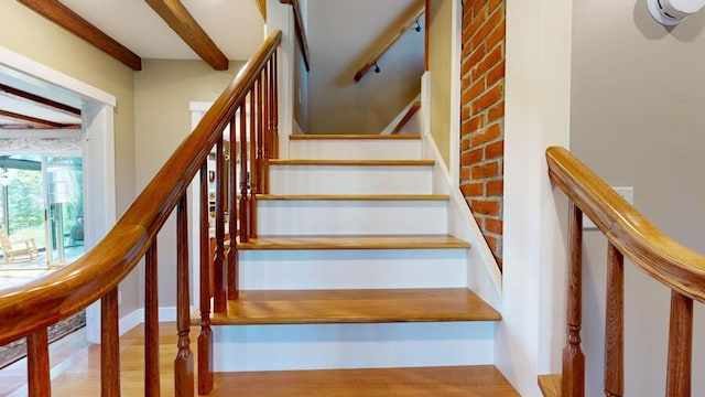 stairway featuring wood-type flooring