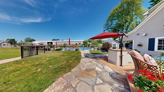 view of yard with a patio and a fenced in pool