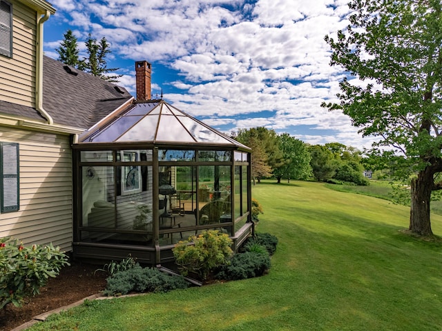 view of yard with a sunroom