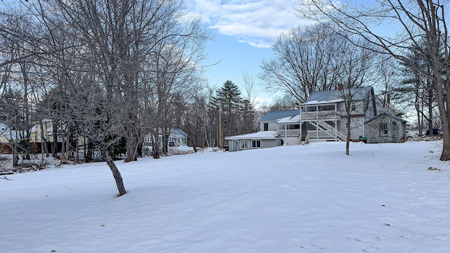 view of yard layered in snow