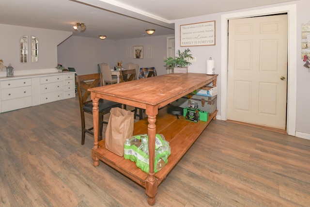 dining area with dark hardwood / wood-style flooring