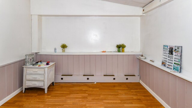 laundry area with light wood-type flooring