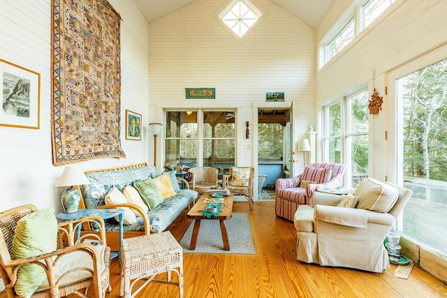 sunroom featuring vaulted ceiling