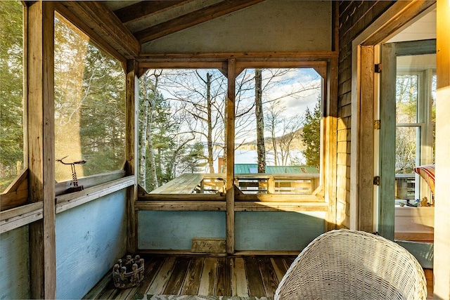 sunroom with lofted ceiling with beams