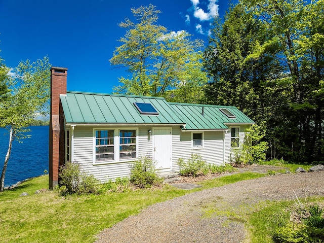 161 Beaucaire Ave, Camden, ME 04843 - view of front of property with a standing seam roof, a chimney, and metal roof