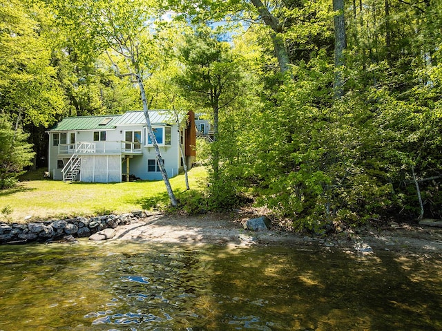 161 Beaucaire Ave, Camden, ME 04843 - back of house with stairs, metal roof, a lawn, a deck, and a standing seam roof