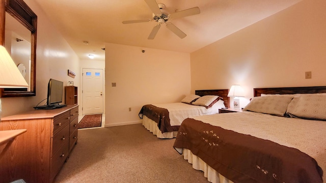 bedroom featuring dark colored carpet and ceiling fan