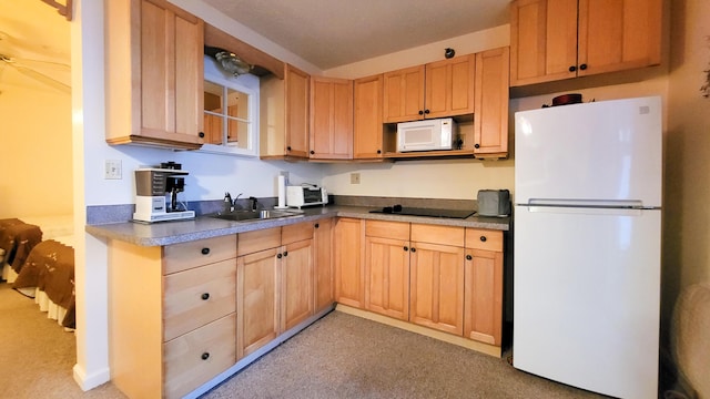 kitchen featuring ceiling fan, sink, light colored carpet, and white appliances