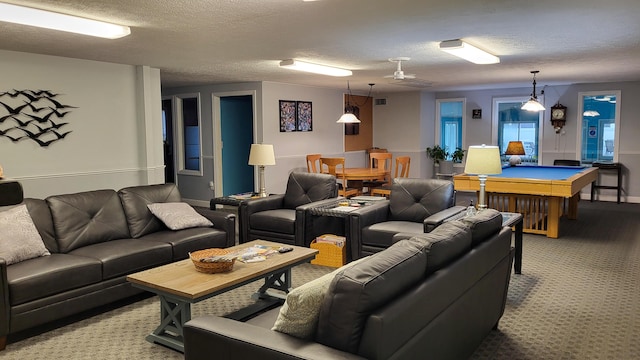 living room with a textured ceiling, carpet floors, and pool table