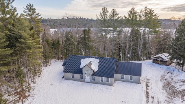 199 Bert Berry Rd, Embden, ME 04958 - snowy aerial view featuring a forest view