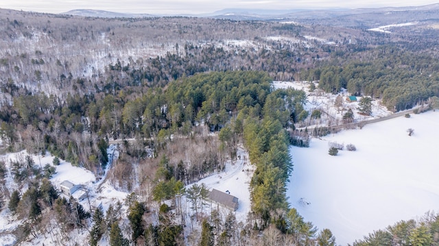 snowy aerial view with a mountain view