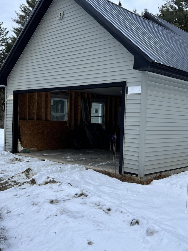 view of snow covered garage