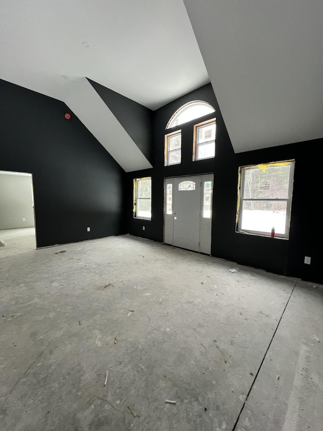 entryway featuring lofted ceiling and a healthy amount of sunlight