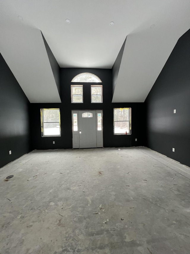 199 Bert Berry Rd, Embden, ME 04958 - unfurnished living room with plenty of natural light and vaulted ceiling