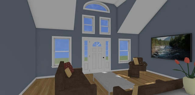 199 Bert Berry Rd, Embden, ME 04958 - entrance foyer with wood finished floors, high vaulted ceiling, and baseboards