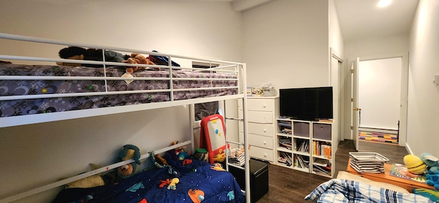 bedroom with dark wood-type flooring