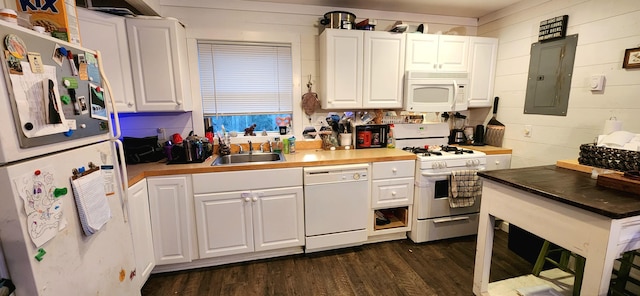 kitchen with white cabinets, white appliances, sink, and electric panel