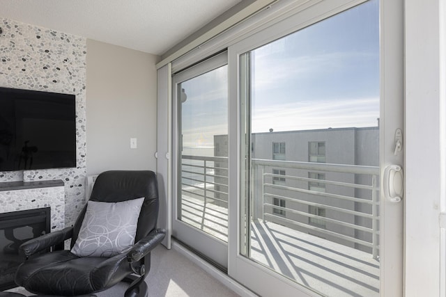 interior space with carpet flooring and a textured ceiling