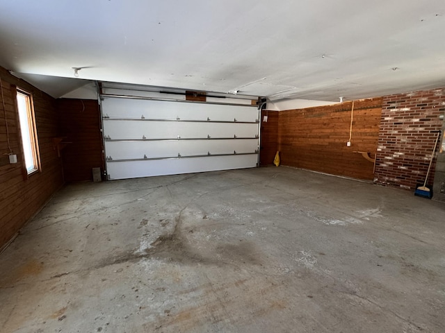 garage featuring wooden walls