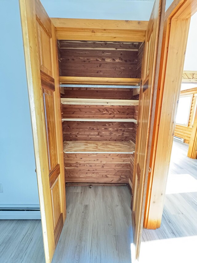 closet with a baseboard radiator