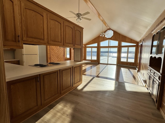 kitchen featuring white appliances, lofted ceiling with beams, a water view, ceiling fan, and light wood-type flooring