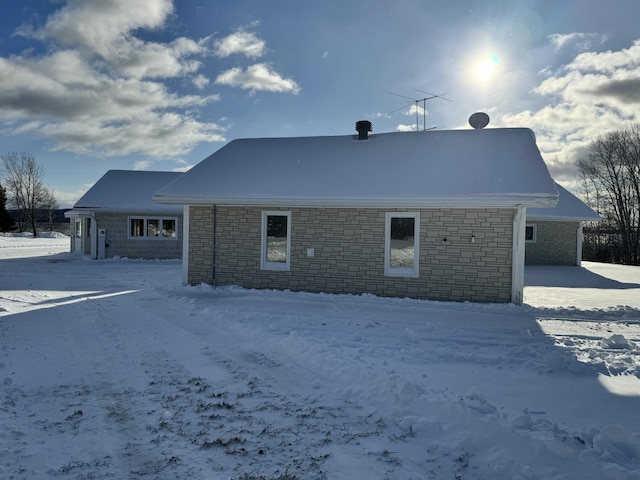 view of snow covered house