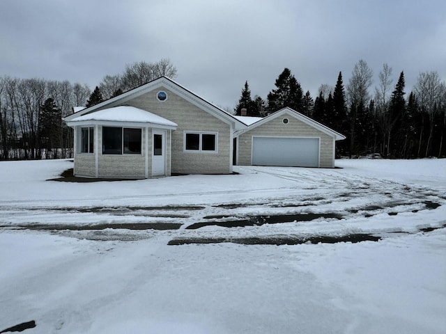 view of front of property with a garage