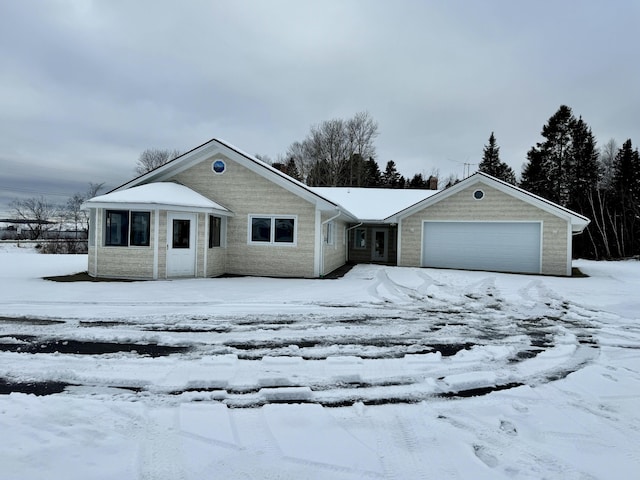 ranch-style house featuring a garage