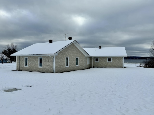 view of snow covered house