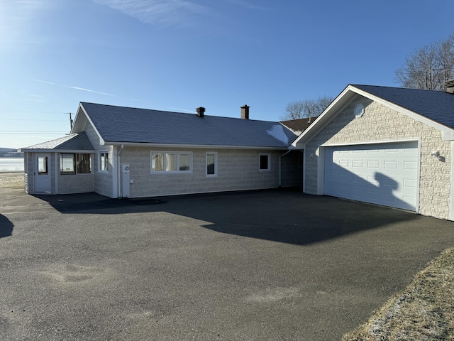 single story home with a garage