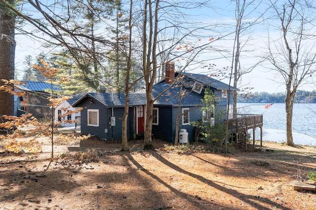 view of front of home with a deck with water view