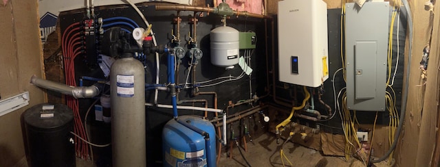 utility room with tankless water heater and electric panel