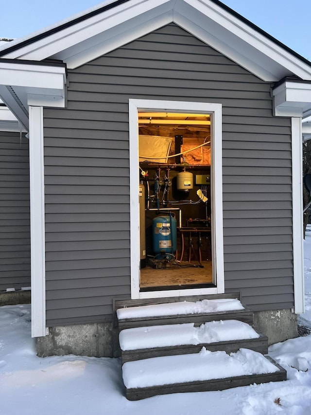 view of snow covered property entrance